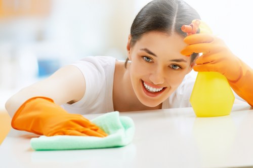 Professional carpet cleaner in Kennington restoring a living room carpet